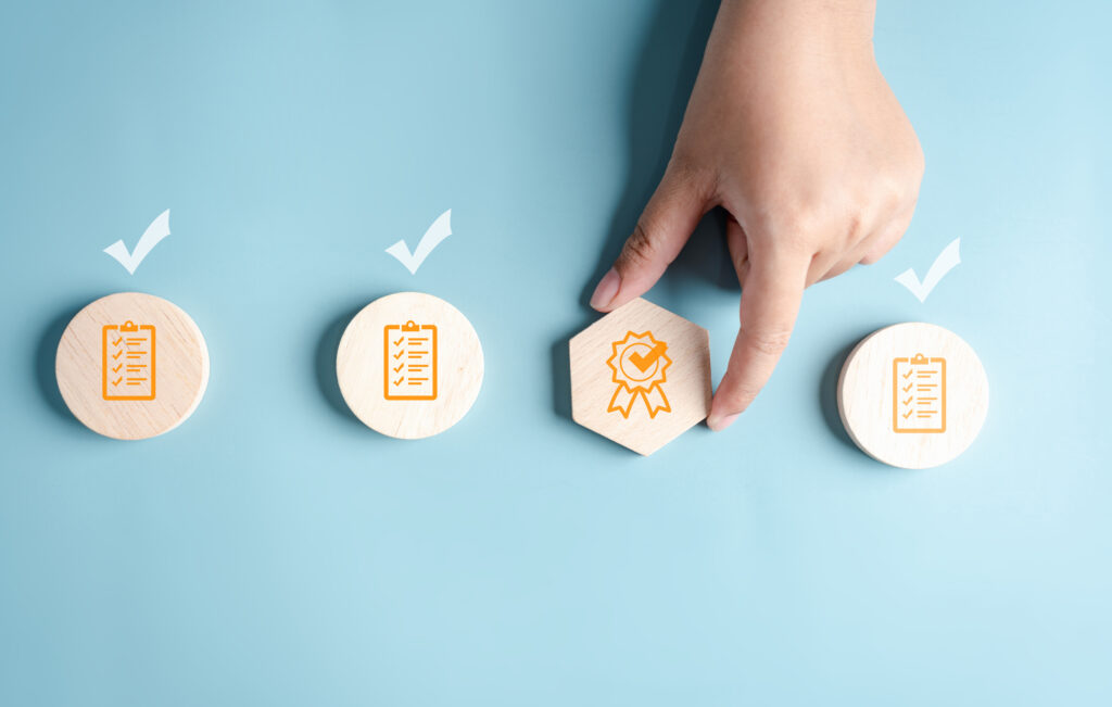 Businessman hand holding sign of the security award image. 