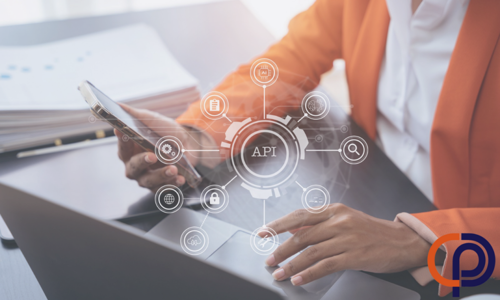 Woman using a laptop, tablet, and smartphone, with a virtual screen displaying an API icon.