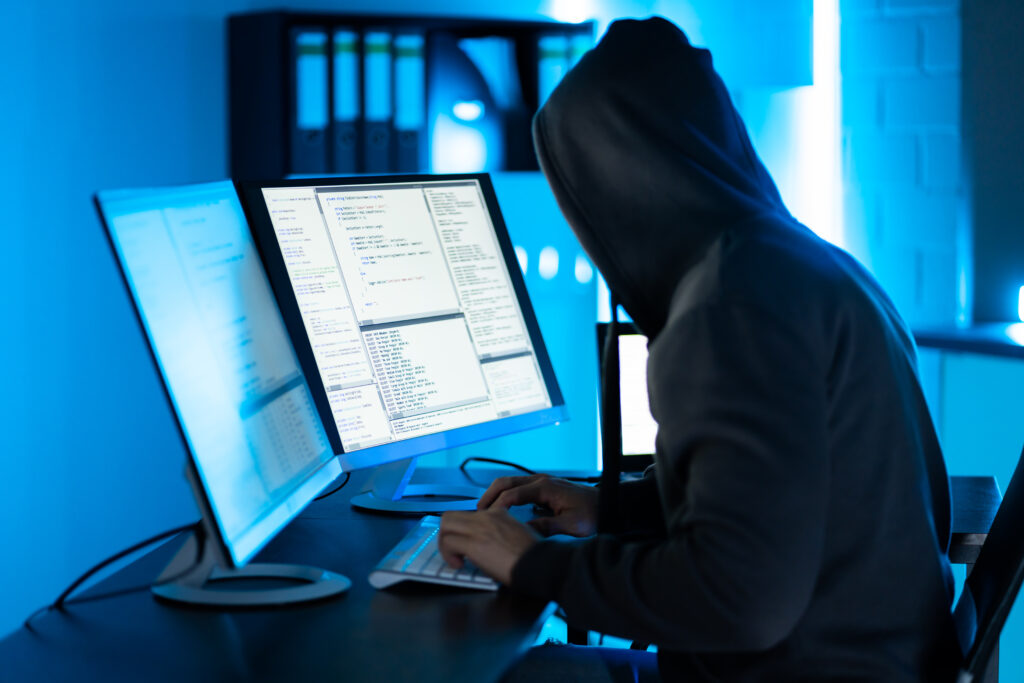 Hacker Using Computer To Write Cyber Security Exploit Software Program