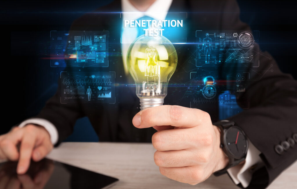 man holding light bulb with words “penetration test” hovering above it