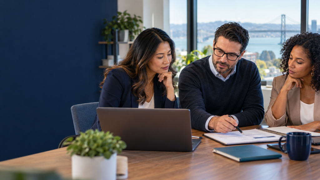Business colleagues reviewing a workflow plan as part of Microsoft AI governance.